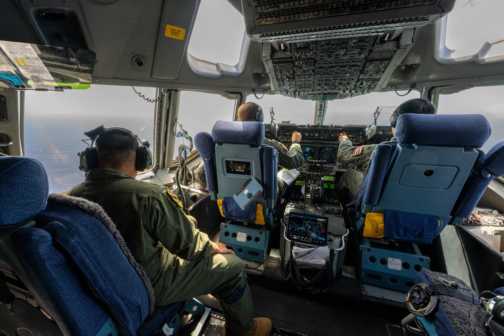 U.S. Air Force aircrew operating a C-17 flight deck
