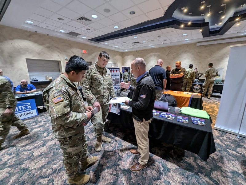 Fort Drum Soldiers talk with employers and industry representatives about job opportunities at a Career and Education Fair hosted by the Fort Drum Transition Assistance Program.